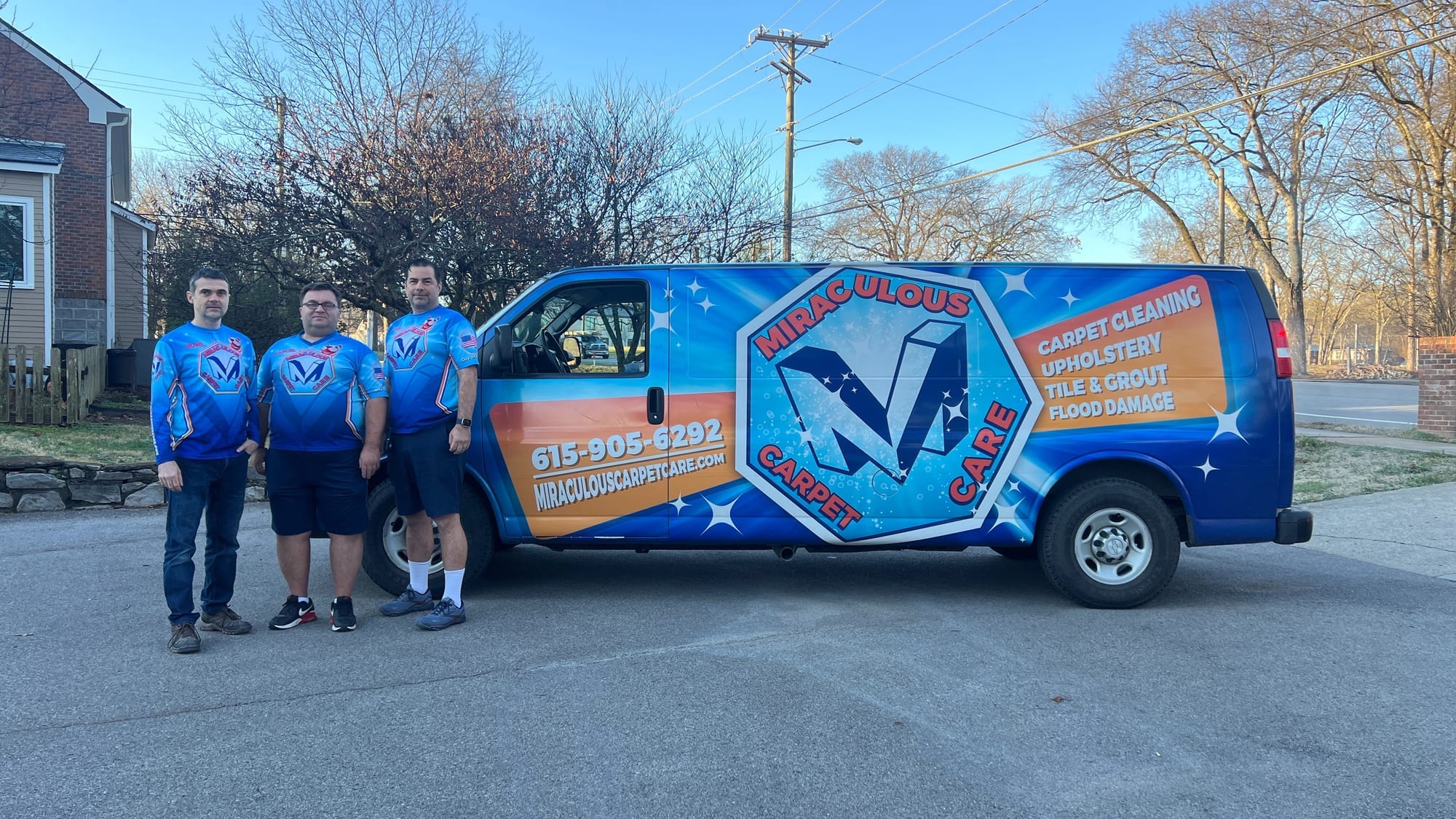 The Miraculous Carpet Care team standing in front of their branded cleaning van