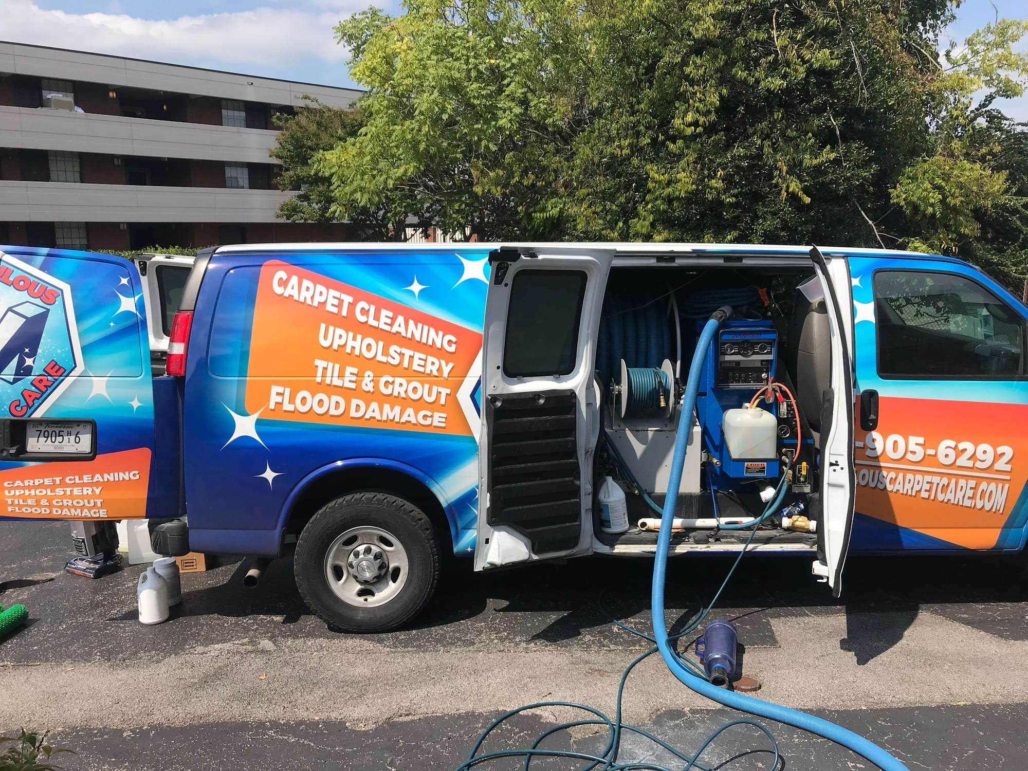 Inside of the Miraculous Carpet Care van showing professional truck-mounted carpet cleaning equipment